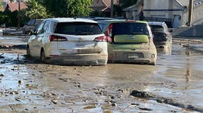 See incredible scenes of deep mud trapping California residents, front-end loader rescue after Hilary